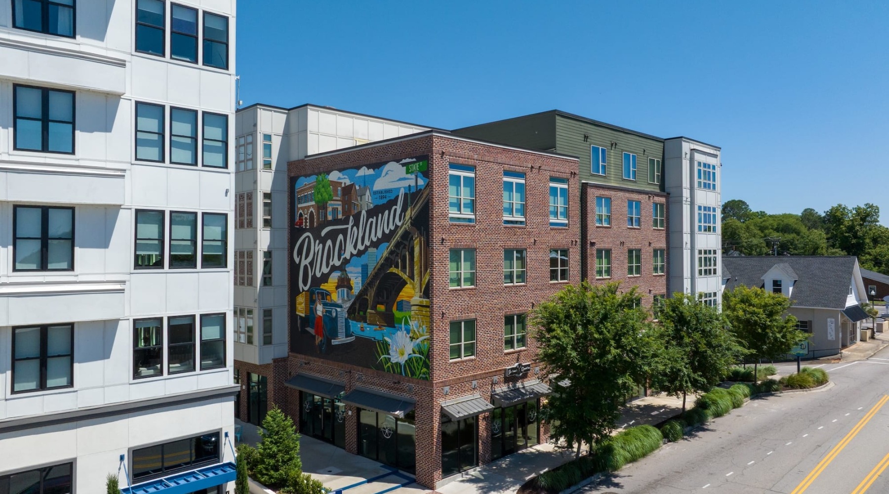 exterior of building showing the property's lush landscaping